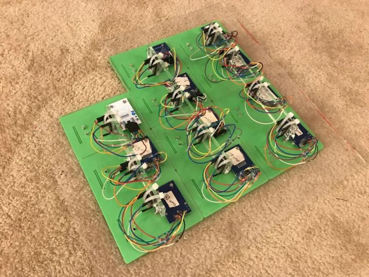 3D printed RFID sensors placed under the OT-2 deck