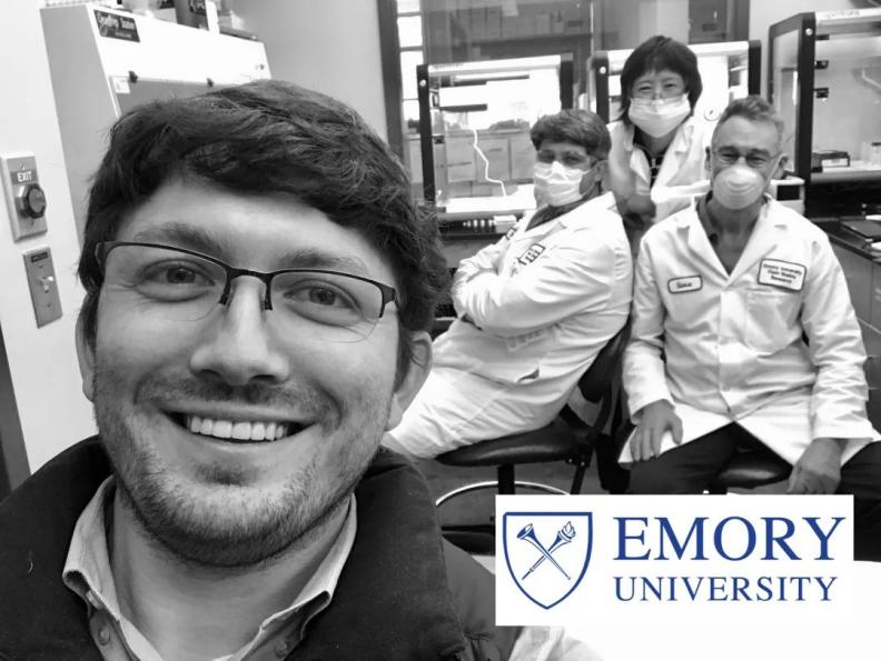 Adam Ericsen (front) in his lab with his 3 OT-2 and lab members Nathan Gullicksrud, Steven Plonk, and Yuhui Wu (l-r). CREDIT: Adam Ericsen